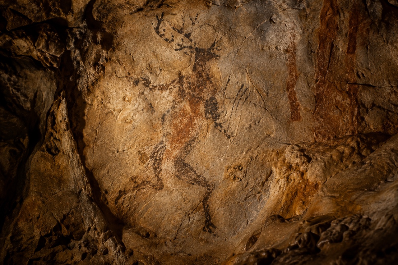 Interpretive cave wall with an ambiguous painted human-animal figure