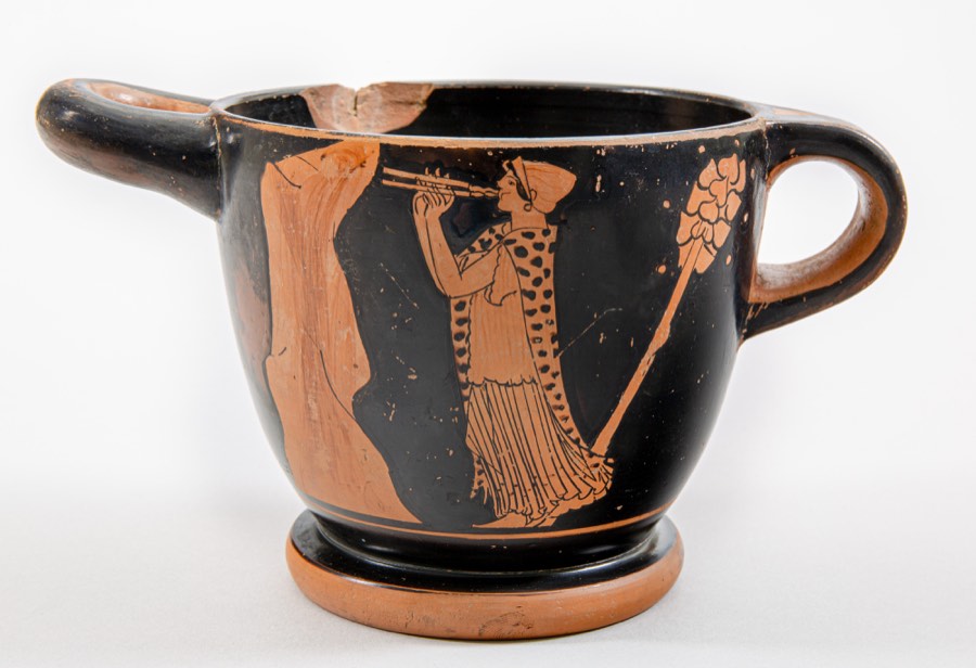 Painted Greek cup depicting maenads in vigorous movement