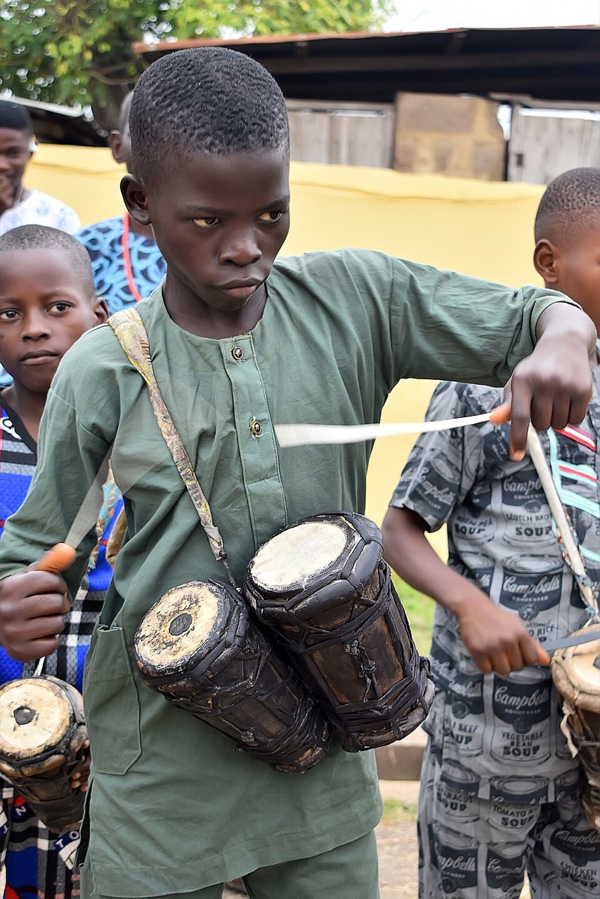 Young players with double-headed bata drums in a contemporary photograph